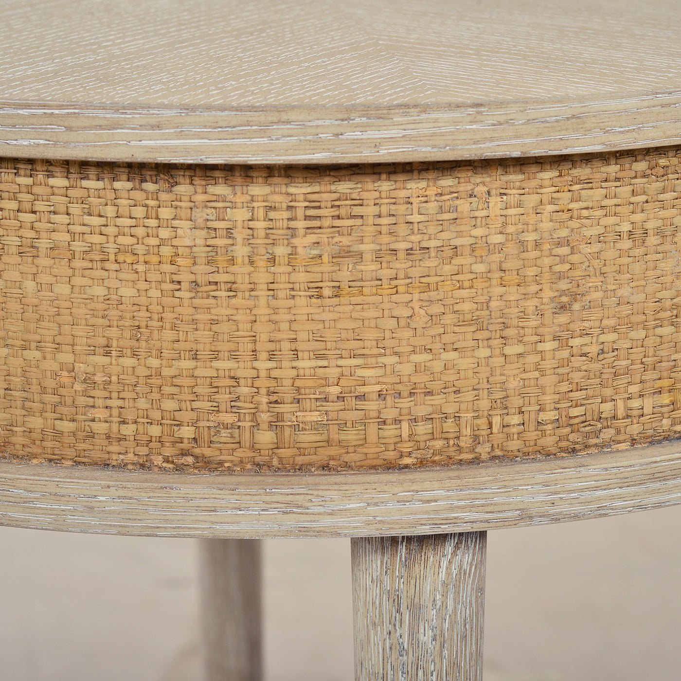 Close-up of woven texture on round side table.
