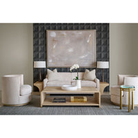 Living room with accent table, beige furniture, modern decor.