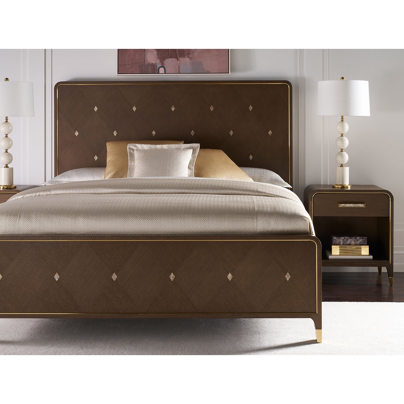 Bedside table in stylish bedroom with decorative lamps.