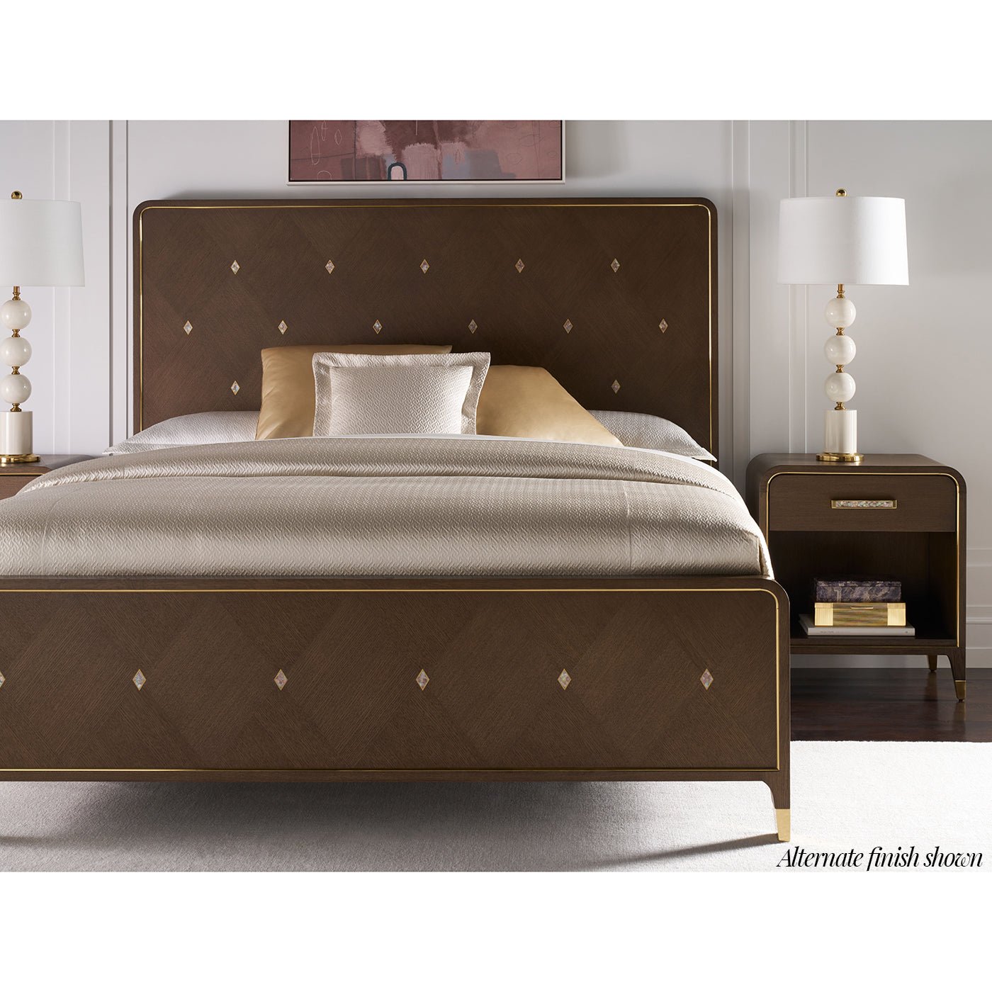 Bedside table in styled bedroom setting with bed.