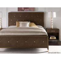Bedside table in styled bedroom setting with bed.