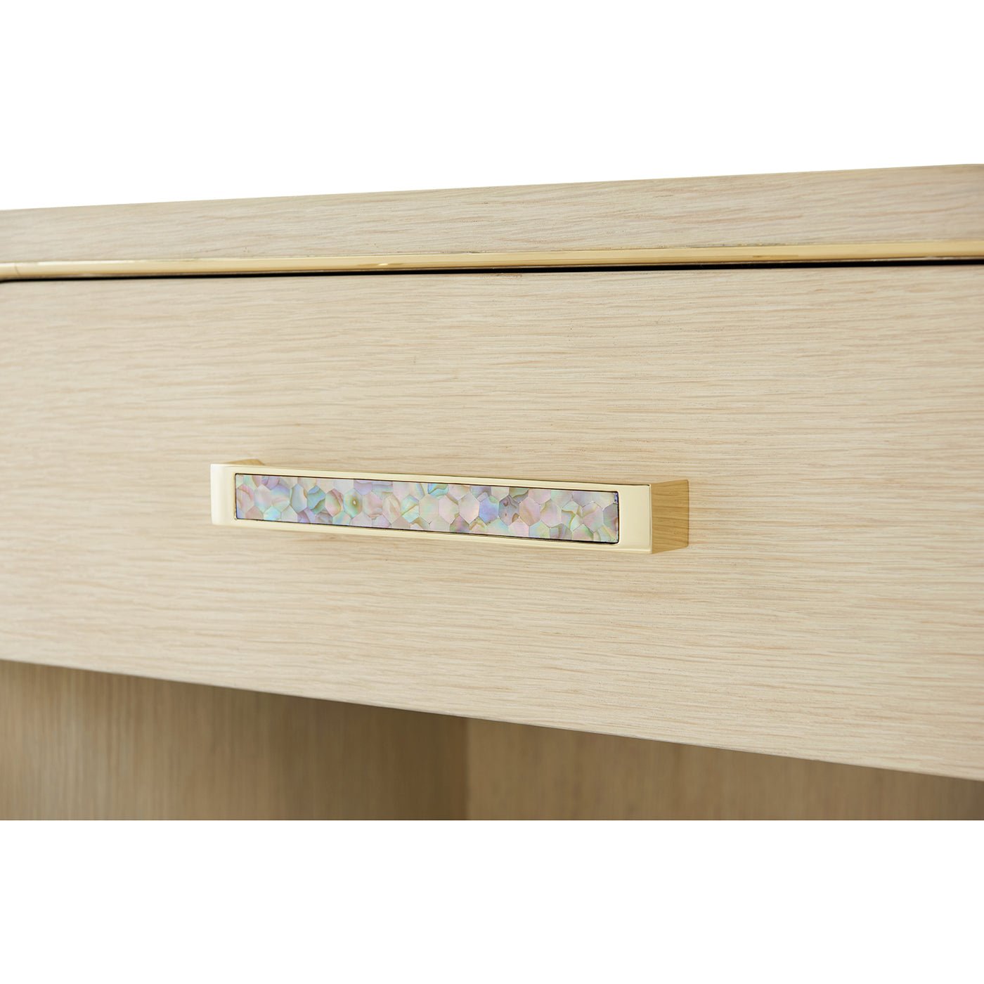 Close-up of bedside table drawer handle detail.