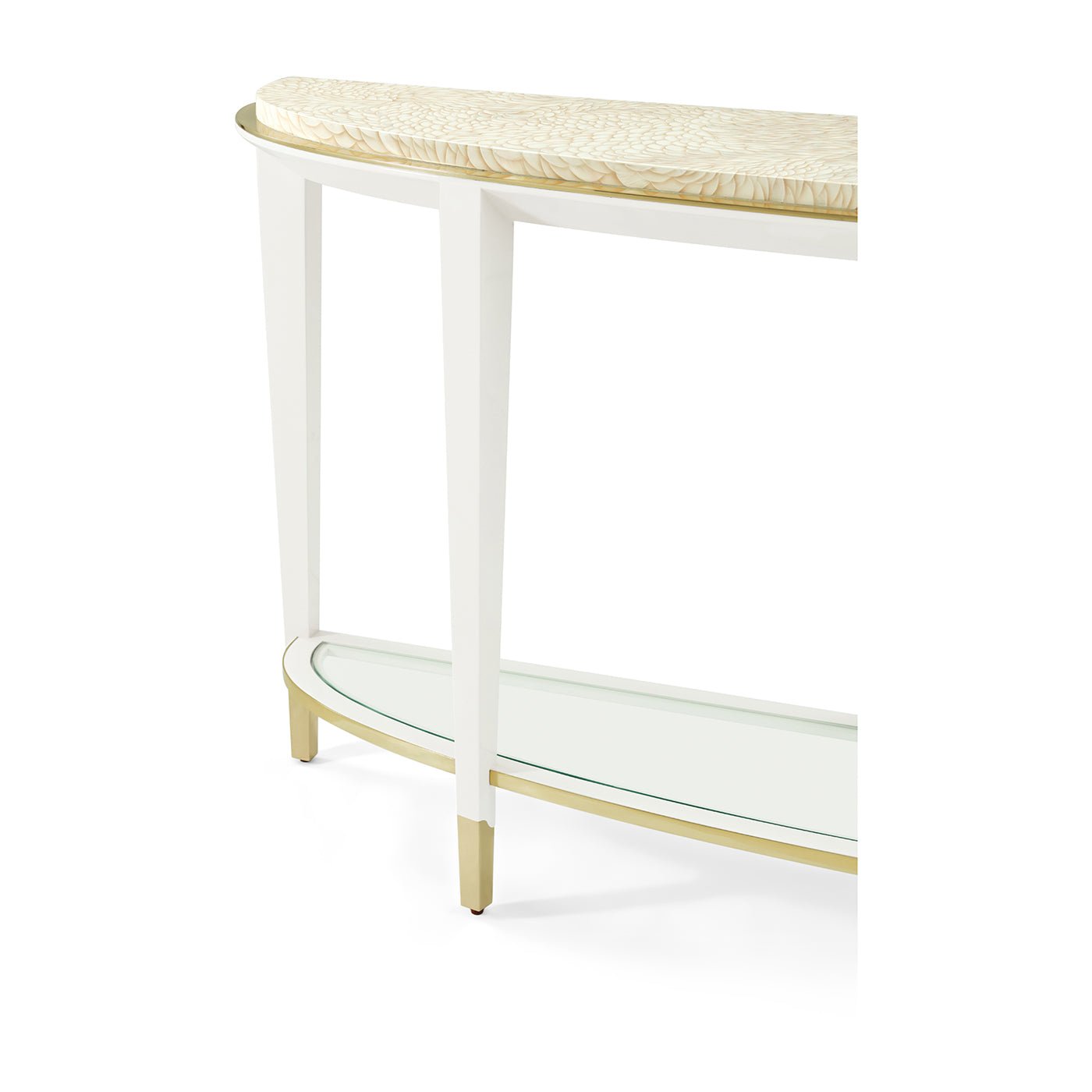 Corner detail of demilune console table with gold accents.