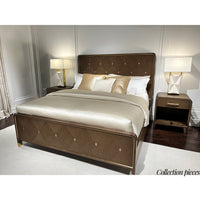 Bedroom set featuring dark wood dresser and bed.