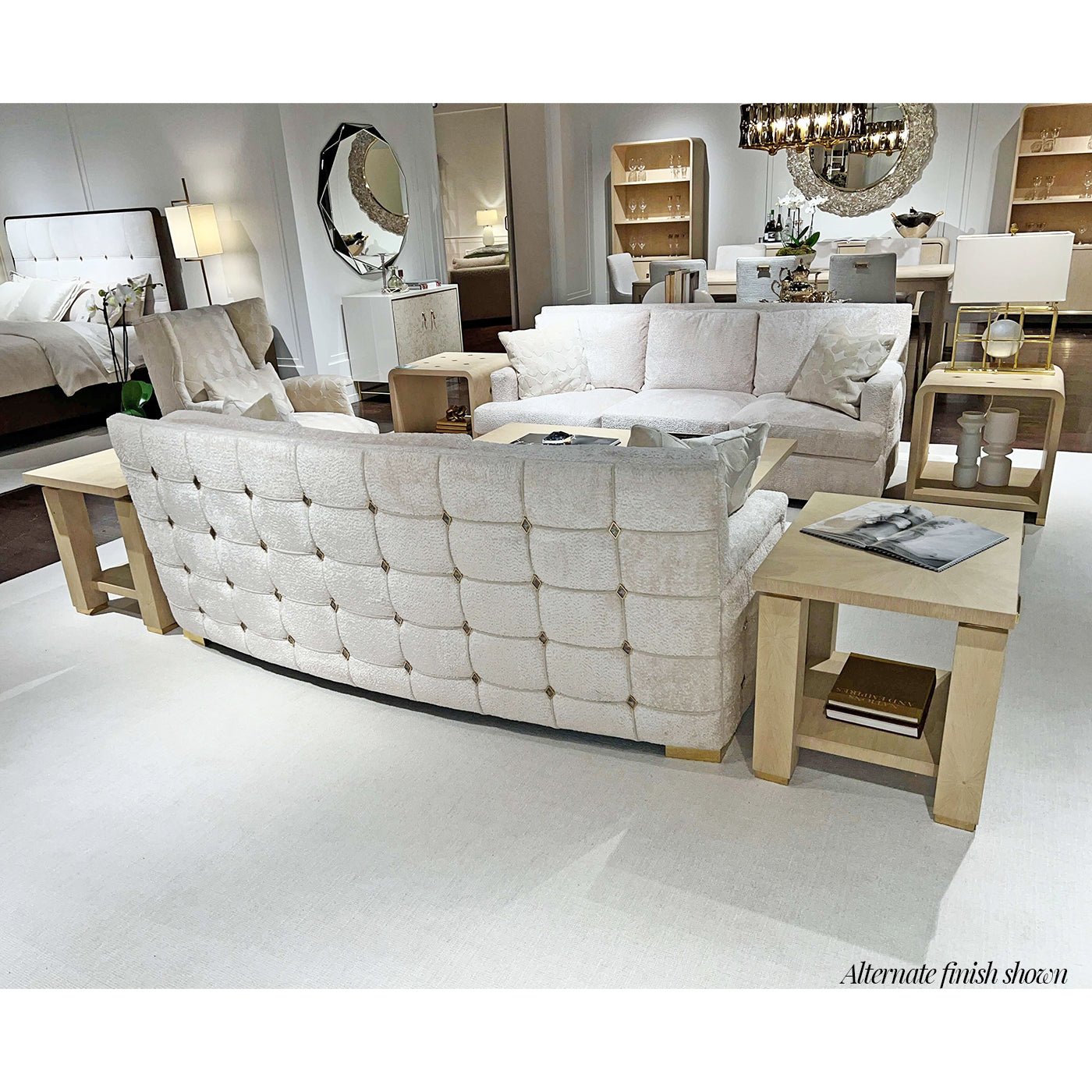 Elegant living room with beige sofas and end tables.