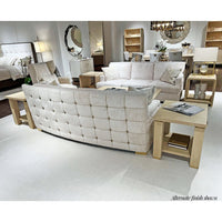 Elegant living room with beige sofas and end tables.