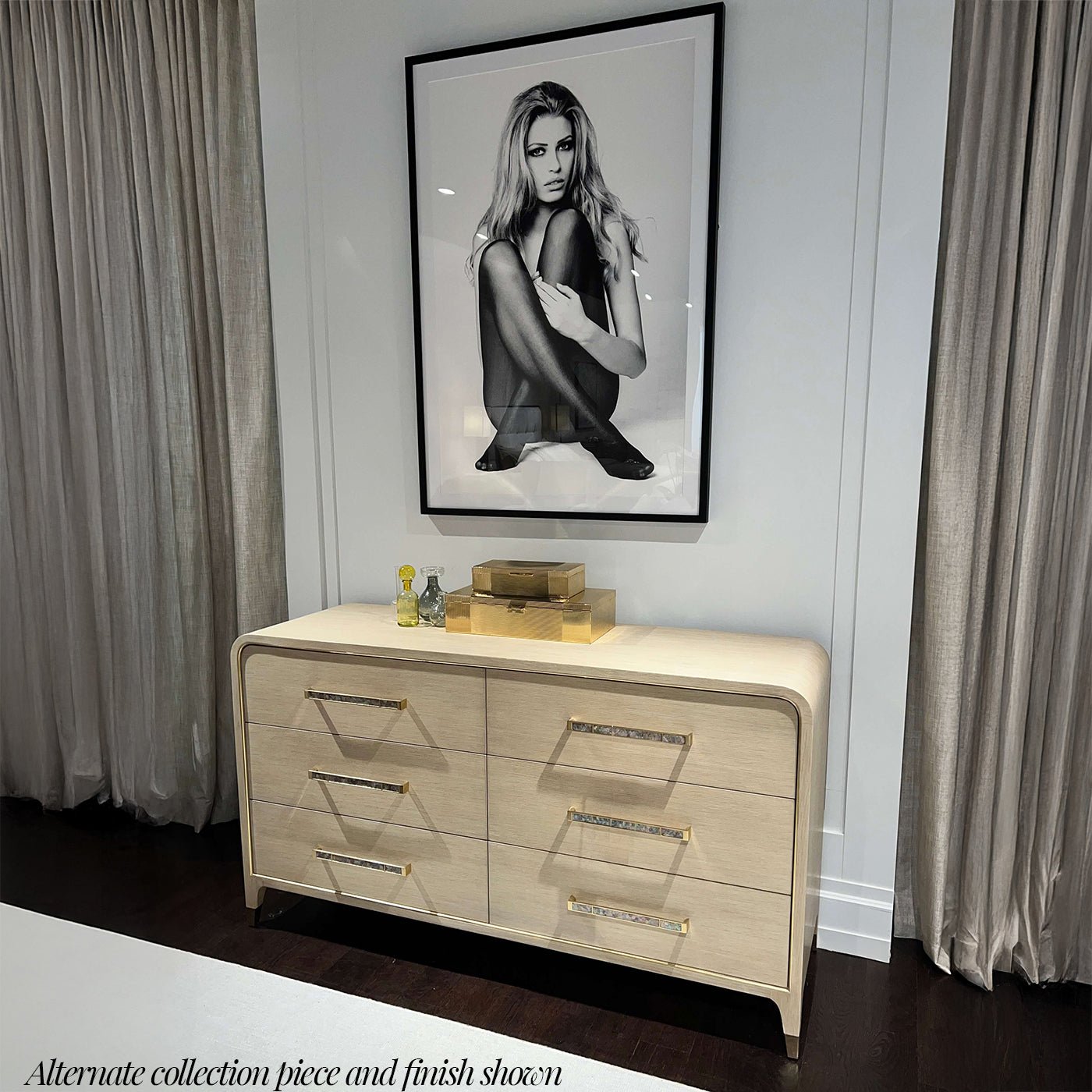 Alternate light finish dresser beneath monochrome artwork.