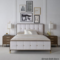 Alternate finish bedroom with artwork, lamps, and matching nightstands.