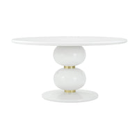 Round dining table with spherical base, side view.