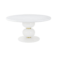 White round dining table with gold accents, front view.