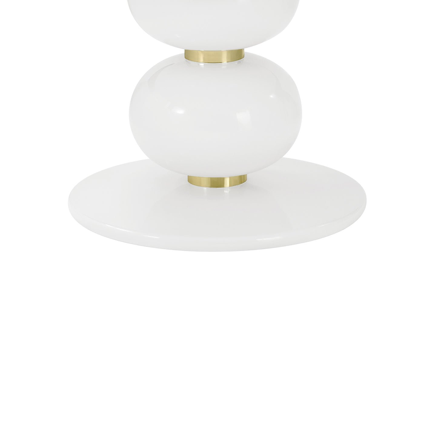Close-up of dining table base with gold accents.