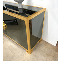 Side view of sideboard highlighting gold frame and details.
