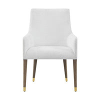 Front view of armchair, white upholstery, gold accents.