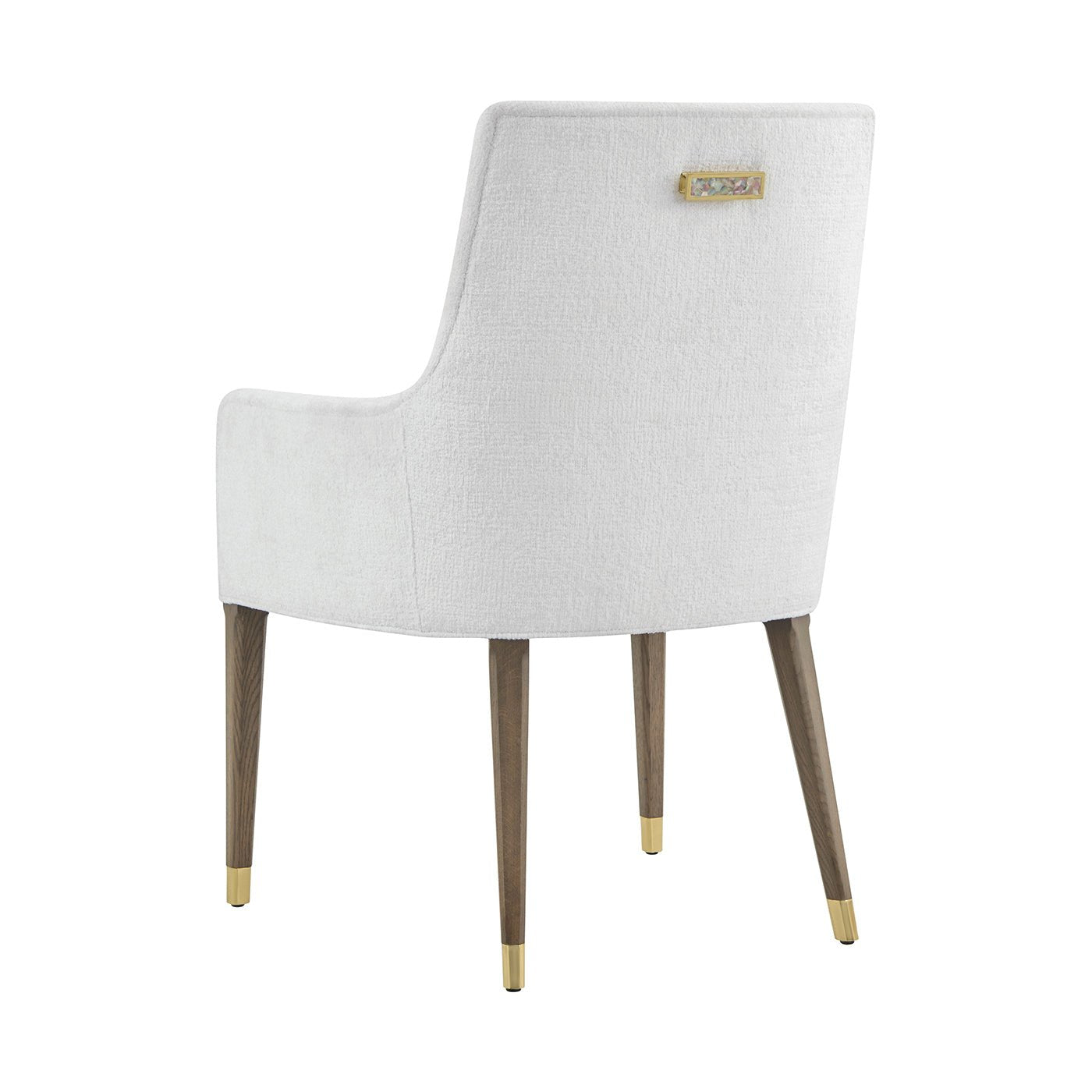 Armchair back view showing wooden legs and handle.