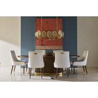 Dining room setting with upholstered chairs around wooden table.
