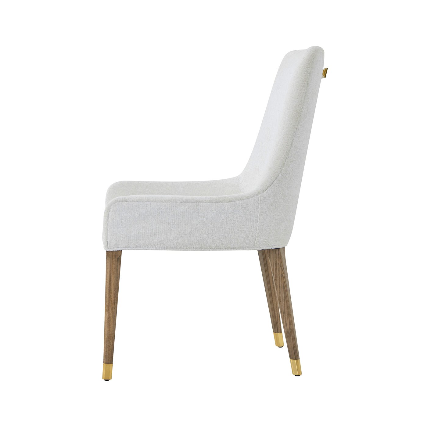 Side profile of white upholstered dining chair, wooden legs.