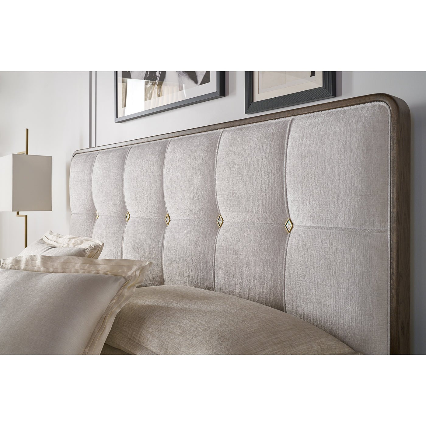 Headboard detail of the Hollywood Regency upholstered king bed.