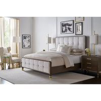 Stylish bedroom setup with upholstered king bed.