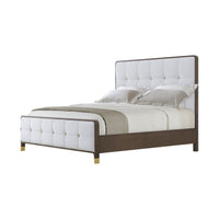 Side view of upholstered king bed with wood frame.