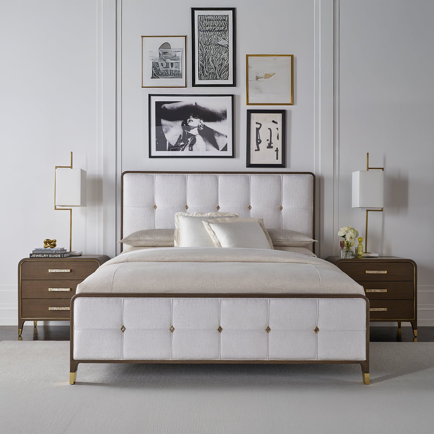 Elegant bedroom featuring upholstered king bed and nightstands.