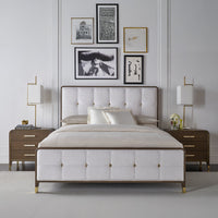 Elegant bedroom featuring upholstered king bed and nightstands.
