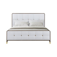 Front view of white upholstered king bed.