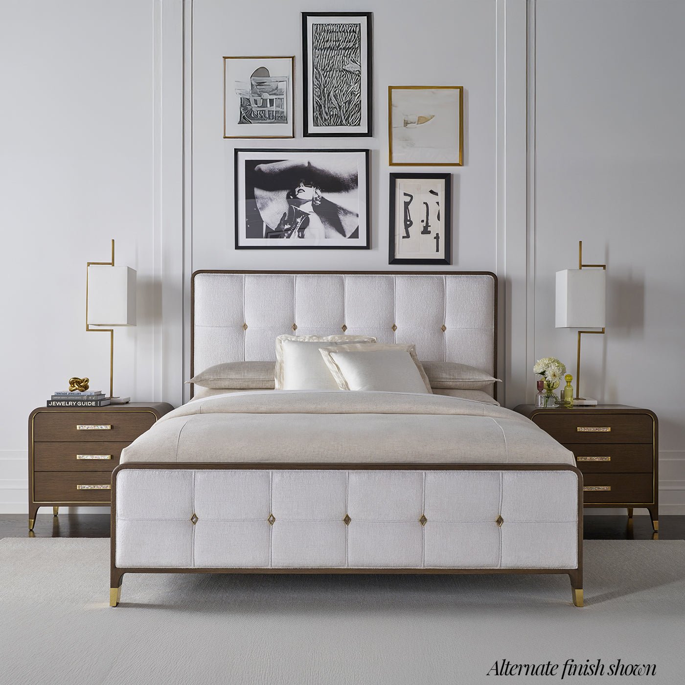 Alternate finish upholstered king bed in styled room.
