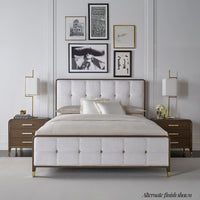 Alternate finish upholstered king bed in styled room.