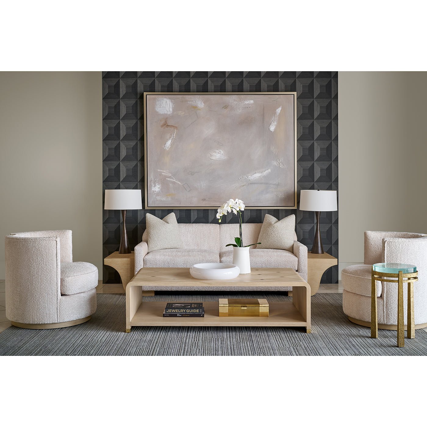 Styled living room with modern coffee table centerpiece.