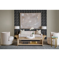 Styled living room with modern coffee table centerpiece.