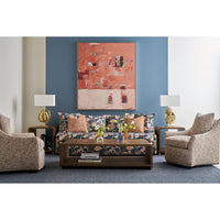 Living room with dark coffee table, floral sofa.