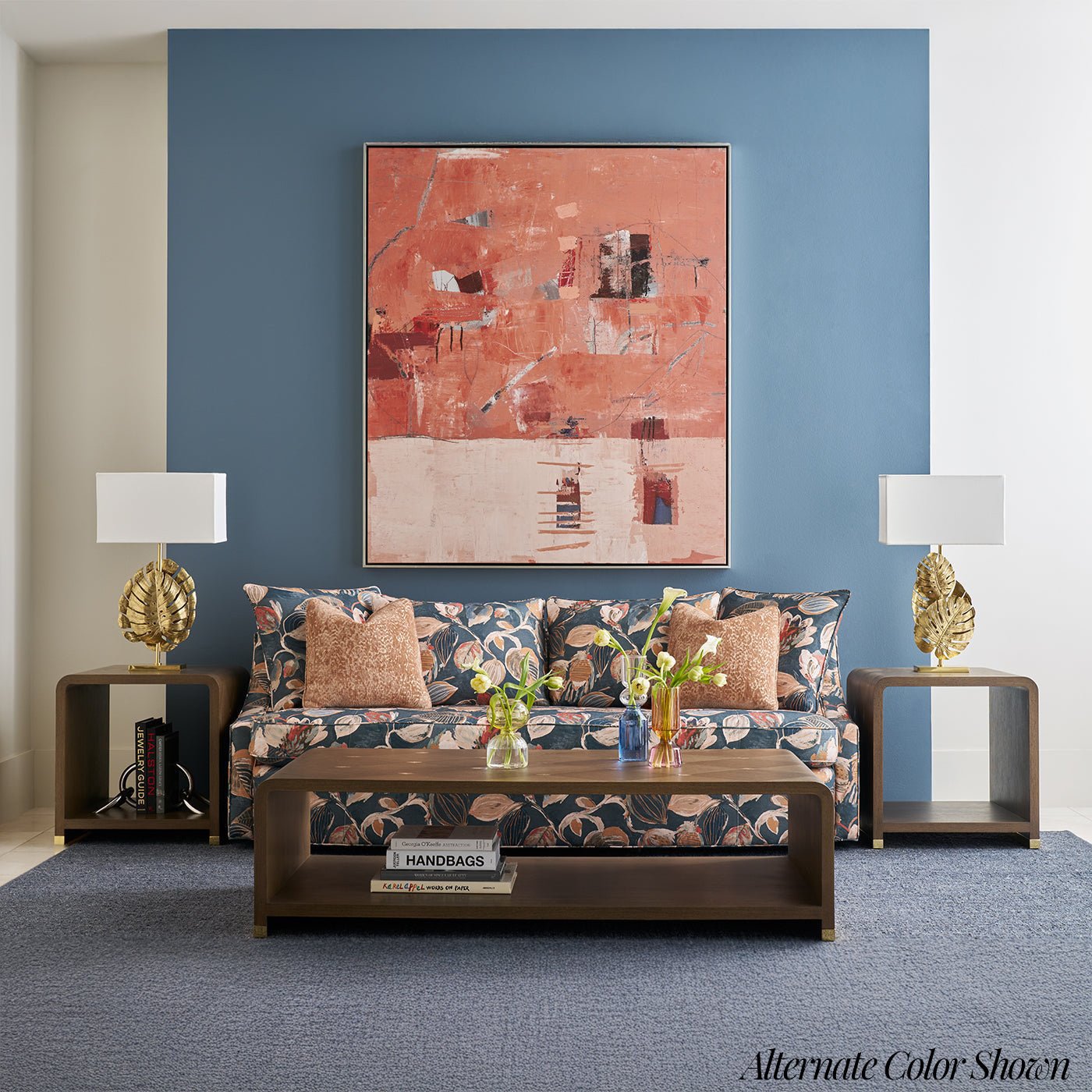 Floral-patterned lounge with matching side tables and lamps.