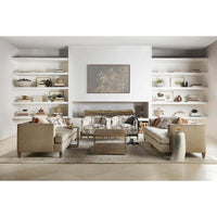 Living room with horn drink table and beige furniture.