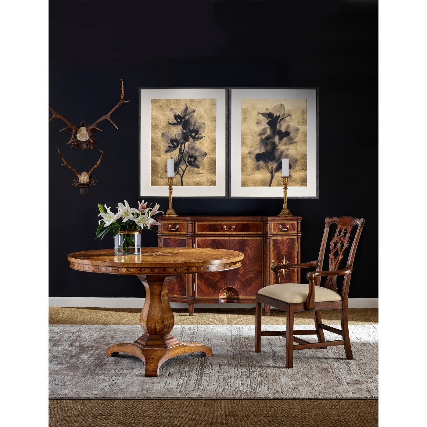 Sideboard in living room setting with table and chair.