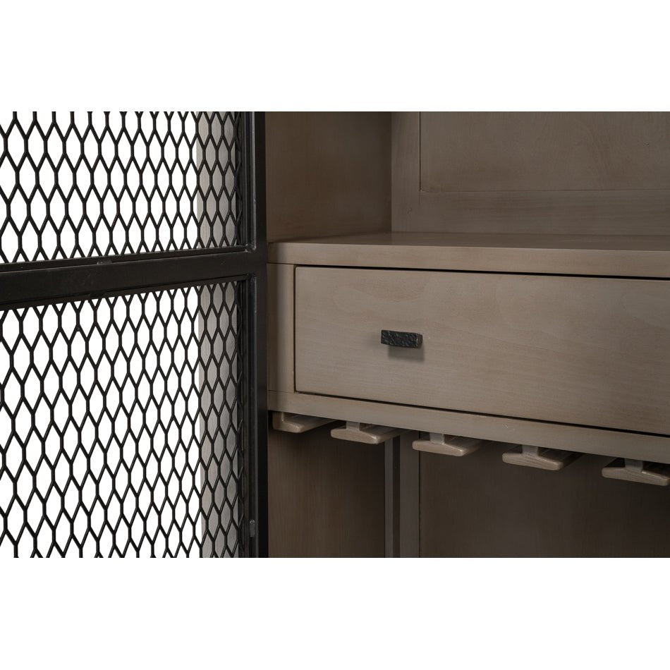 Drawer detail inside industrial bar cabinet with wine rack.