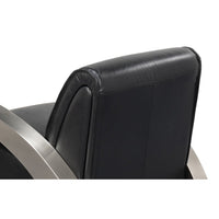 Industrial armchair, rear angle view of backrest and frame.
