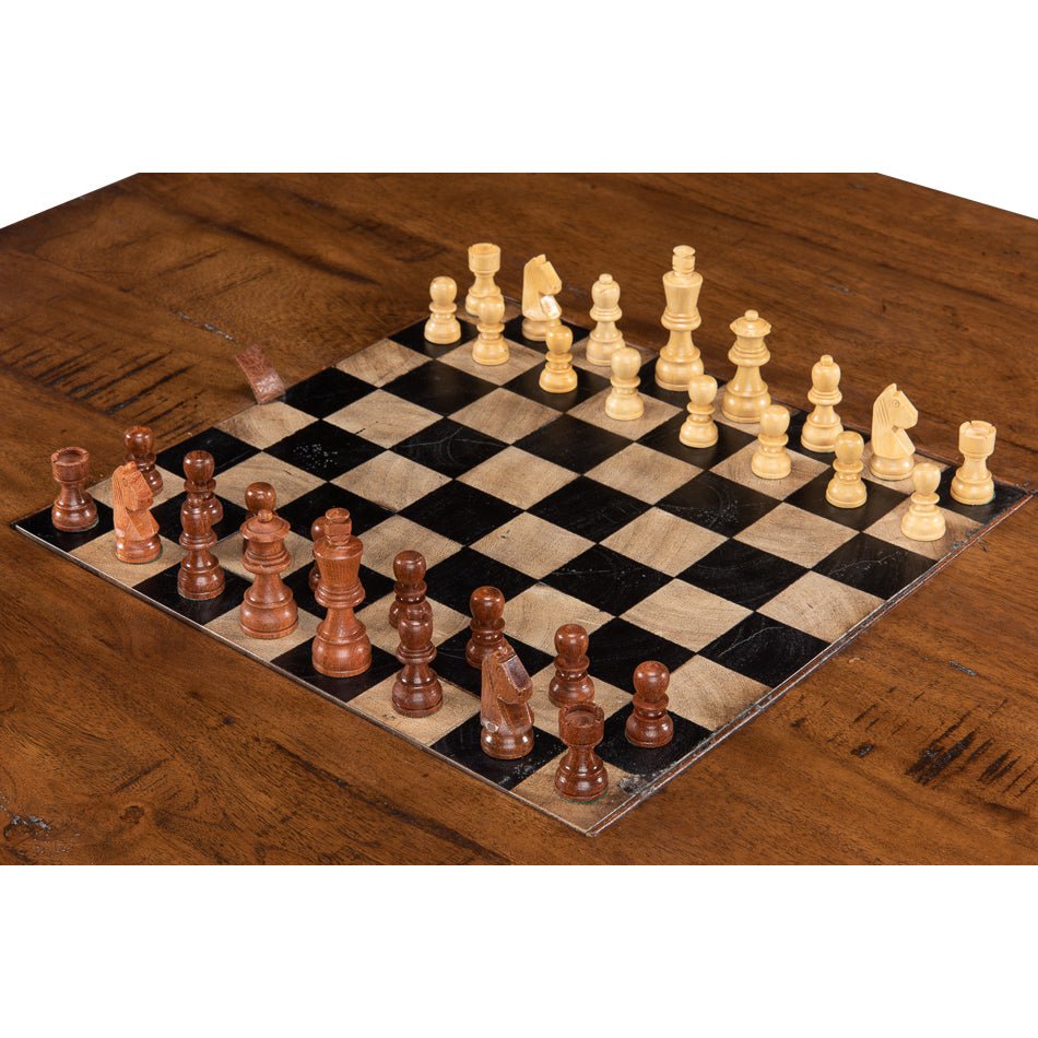 Close-up of chess pieces on wooden coffee table.