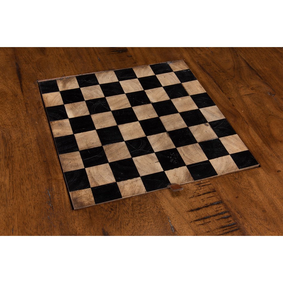 Chessboard design on wooden coffee table top.