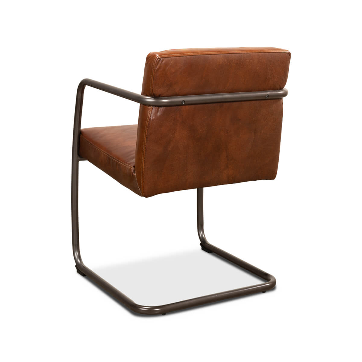 Rear angled view of industrial leather armchair, metal accents.