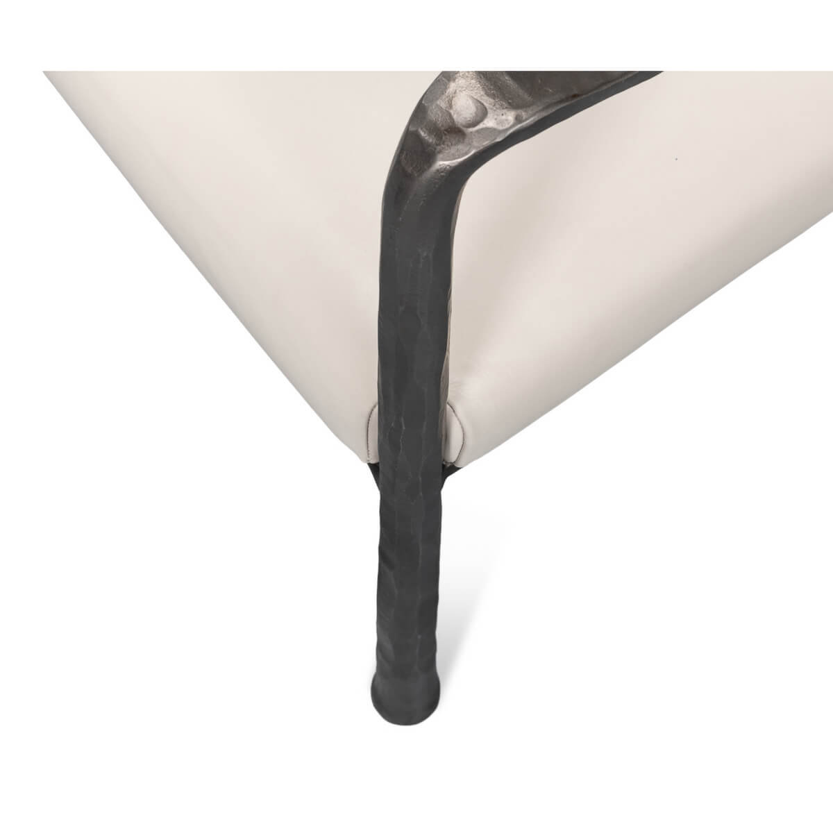 Close-up of bench leg and cushion.