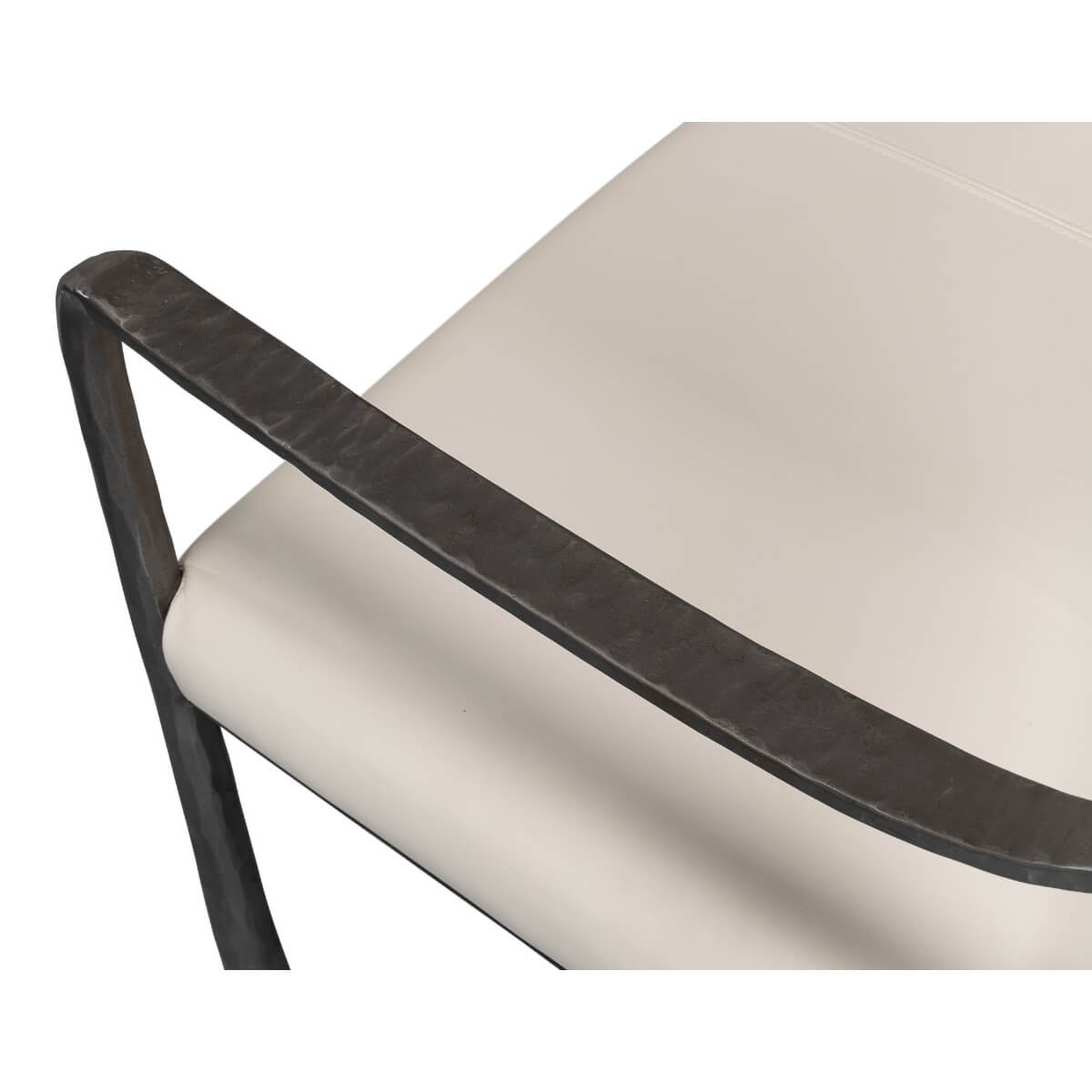 Close-up of bench armrest and cushion.