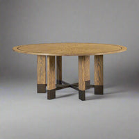 Industrial-style round dining table on grey background.