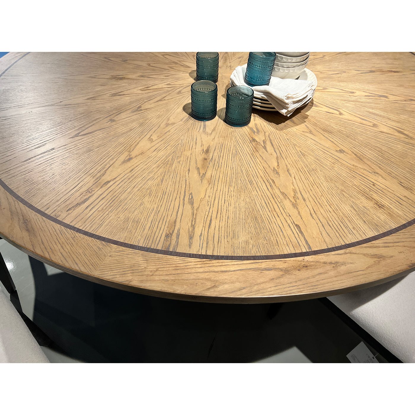 Close-up of dining table top with circular pattern.