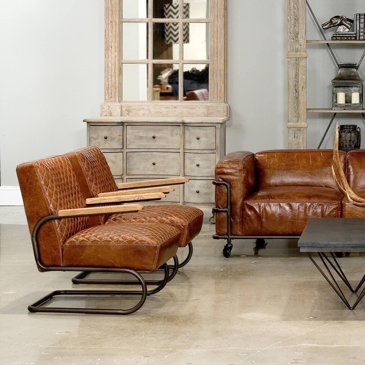 Living room setup, two brown leather chairs, modern decor.