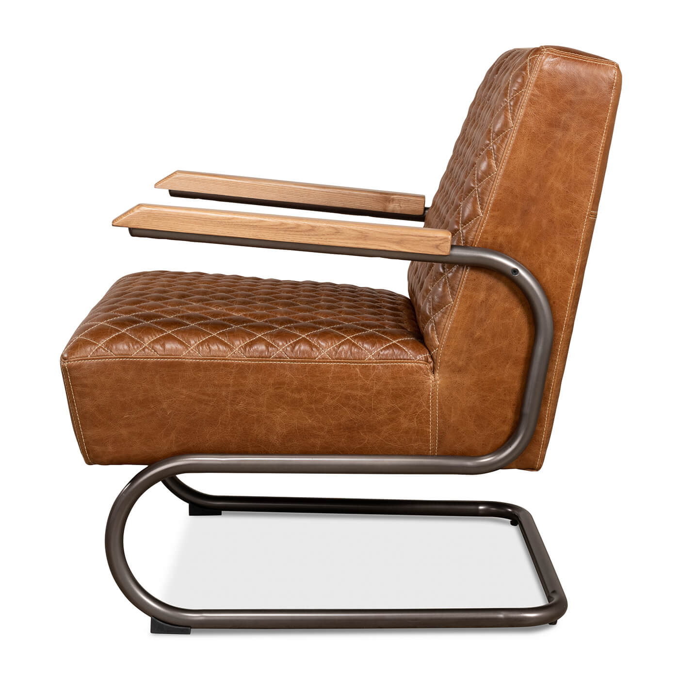 Side view, brown quilted leather armchair with metal base.