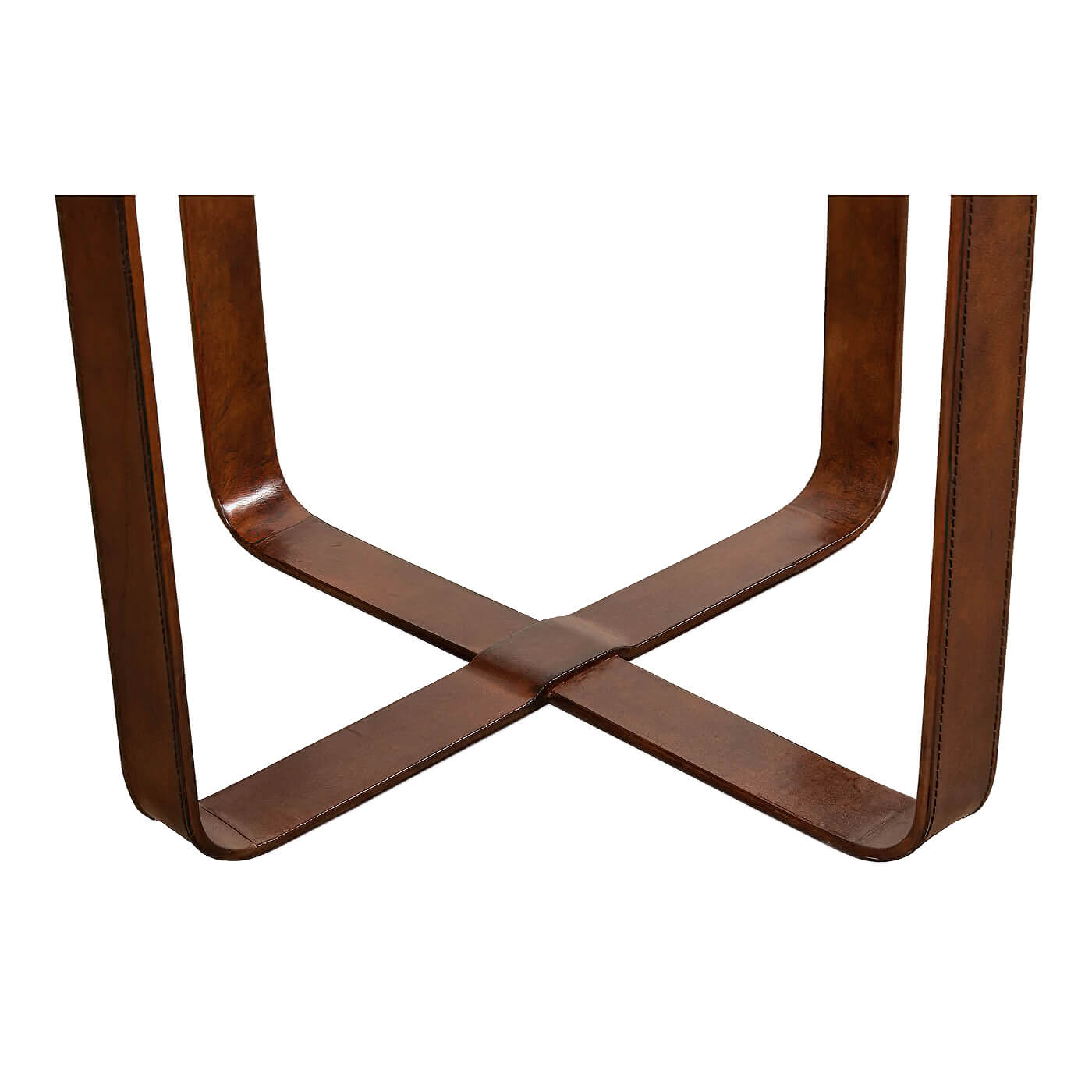 Base detail of round leather end table in brown.