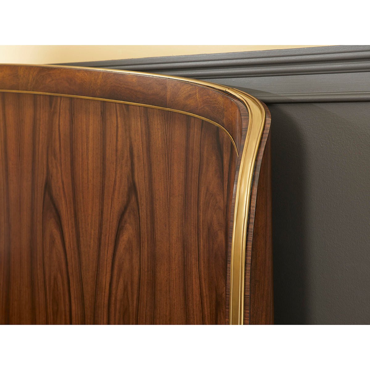 Headboard corner detail on wooden king bed.