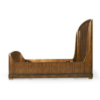 Side view of empty wooden king bed frame.