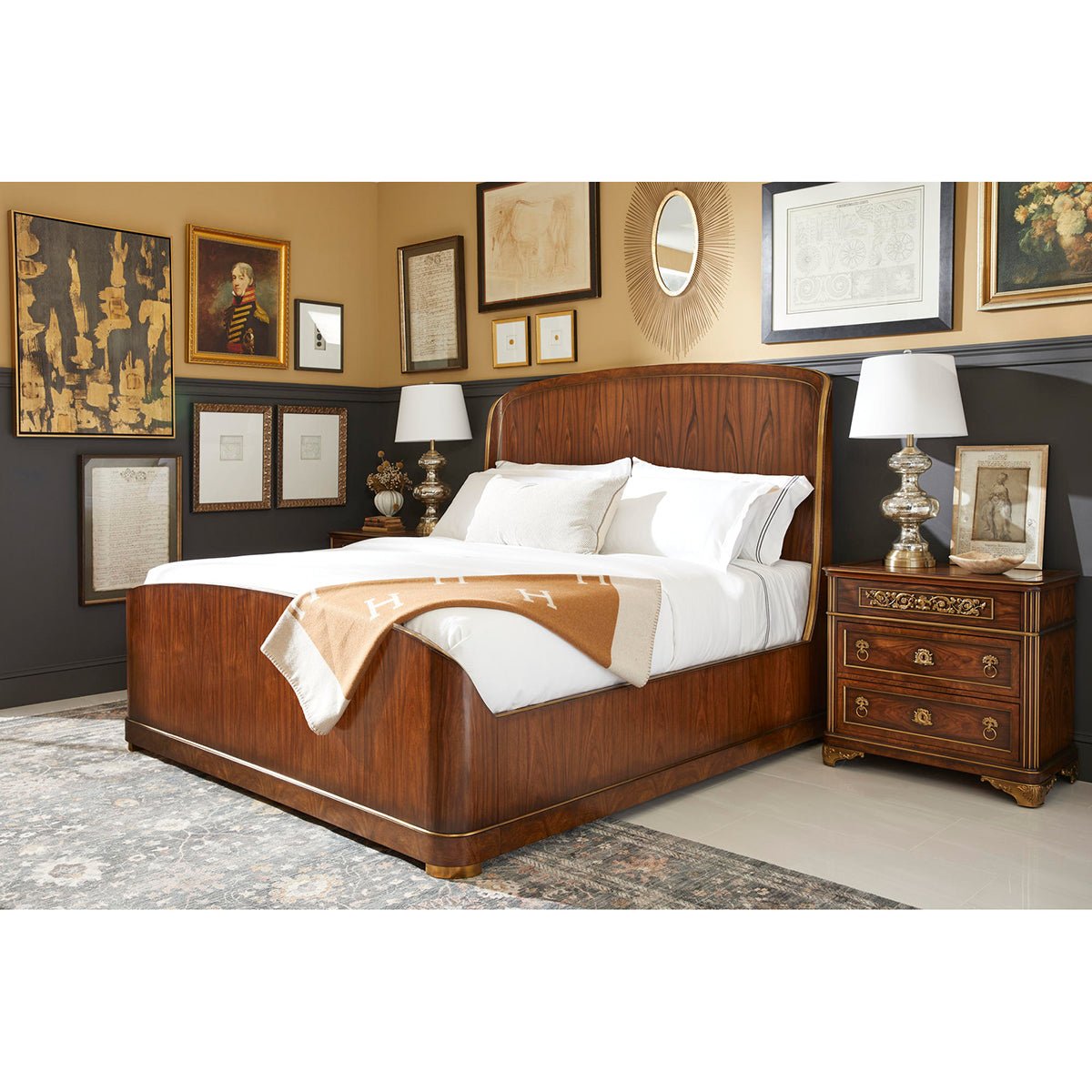 Styled bedroom with wooden king bed and décor.
