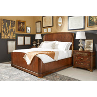 Styled bedroom with wooden king bed and décor.